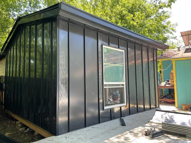 Black standing seam metal wall panels for Roof Inspection in Berthoud