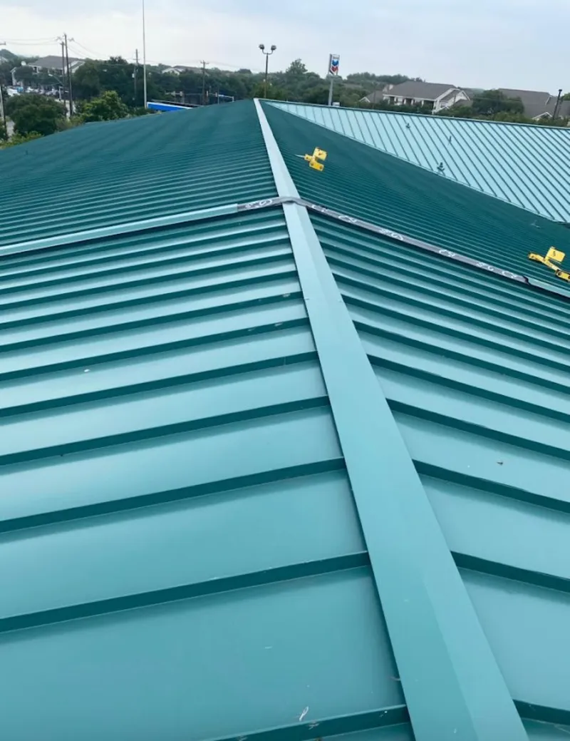 Green commercial metal roof ridge and valley for Metal Roof Repair in Berthoud